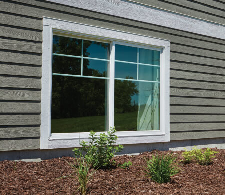 Forgent Series single sliding windows with a Cloud exterior color that is integral to the Glastra material.