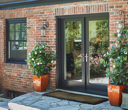 Forgent Series crank-out casements and swinging patio doors with a Cloud exterior color that is integral to the Glastra material.