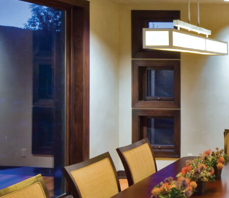 Ultra Series push-out awning windows with Alder interior wood and Oil-Rubbed hardware.
