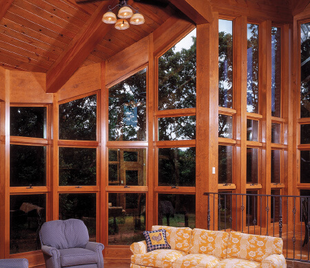Ultra Series crank-out awnings and geometric windows in a rustic great room.