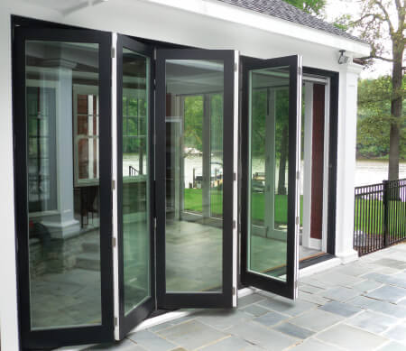 Ultra Series folding doors with Coal Black exterior finish and Satin Nickel hardware.