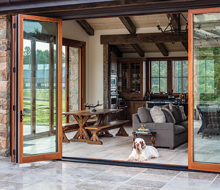 VistaLuxe folding door with Coal Black exterior finish and panels stacked open to one side.